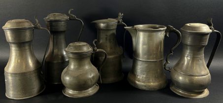 Six assorted 19th century pewter jugs / tankards.