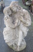A weathered cast composition stone Romeo & Juliet garden figure group 64 cm high