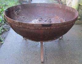 A weathered Kadai riveted iron fire pit and stand, 71cm diameter x 43cm high