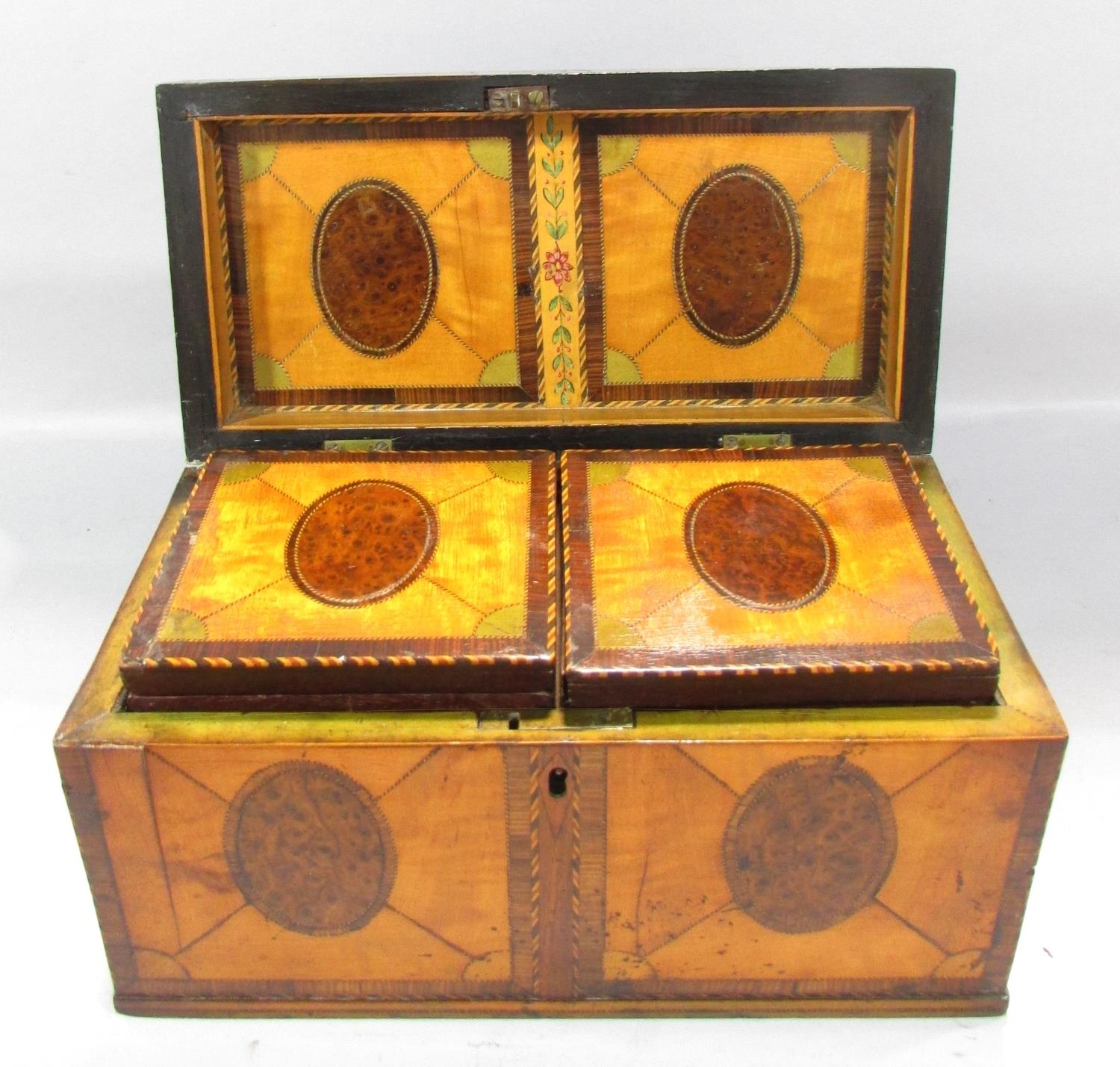 An 18th century satinwood and burr walnut veneered tea caddy, the lid opening to reveal two matching