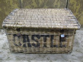 A vintage wicker laundry basket of commercial size
