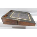 A Victorian walnut writing slope with a black and gold tooled leather writing surface, hinge in need