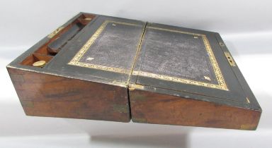 A Victorian walnut writing slope with a black and gold tooled leather writing surface, hinge in need