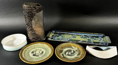 A collection of studio pottery by Clare Watson, John Leach comprising dishes and vases (9 pieces)