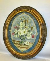 A late 18th century petit point needlework, depicting a vase and floral bouquet finely worked in