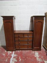 A sentry box wardrobe, the middle section fitted with three long and two short drawers flanked by