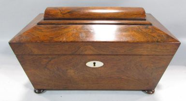 A Regency rosewood sarcophagus tea caddy with a glass mixing bowl flanked by two caddies, wooden