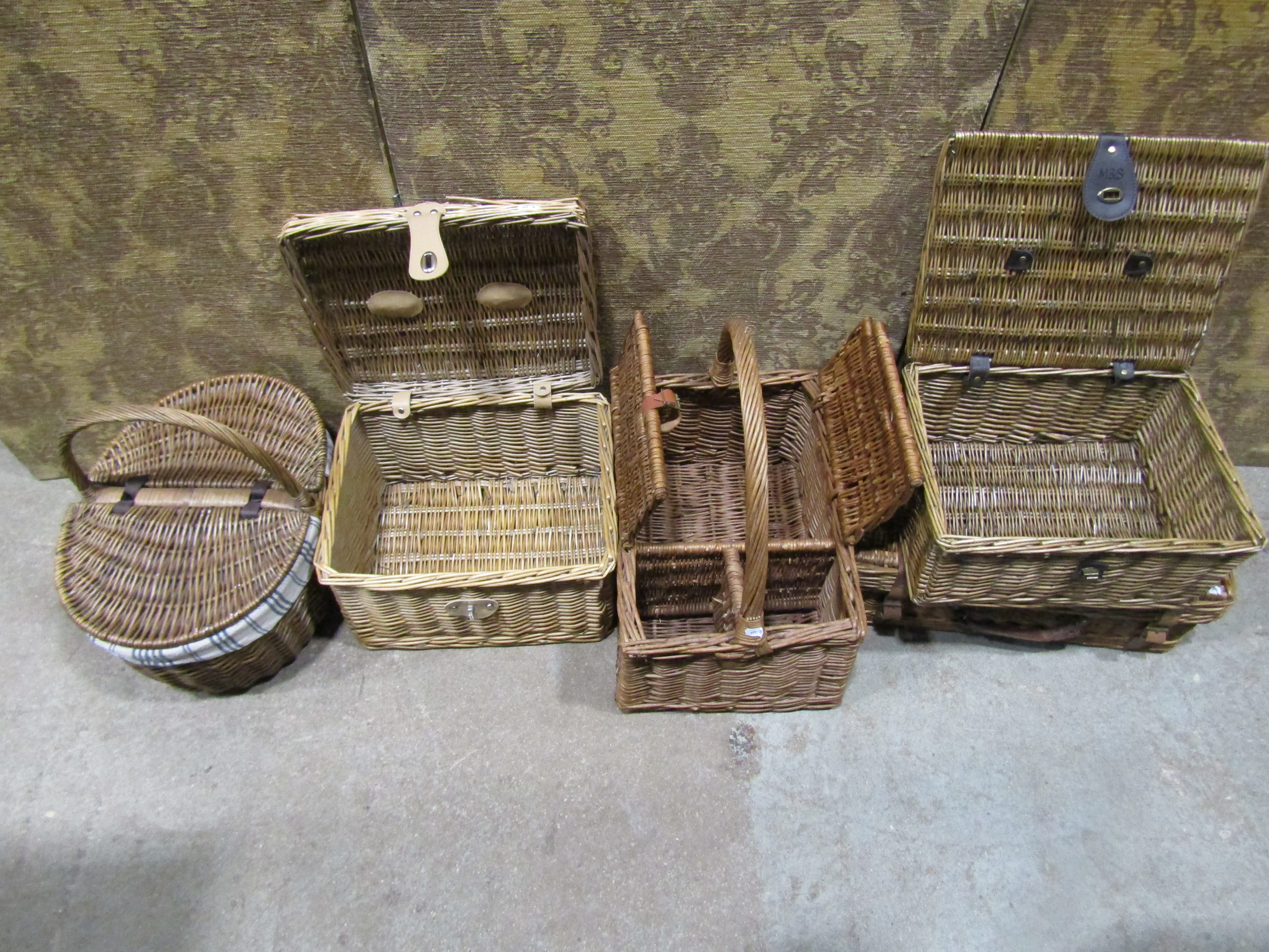 A quantity of various wicker baskets of various shapes and divisions