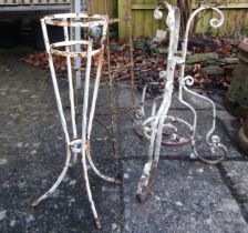 A painted and weathered vintage saucepan stand, a cast iron table base with scrolling supports and a