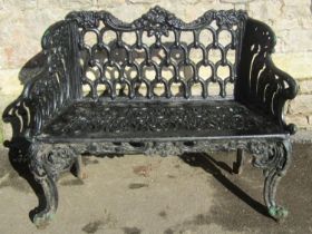 A good quality cast iron garden bench with decorative pierced detail, swept supports and over