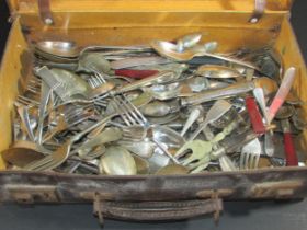 A Collection of mixed silver plate cutlery in a leather valise together with a vintage picnic basket