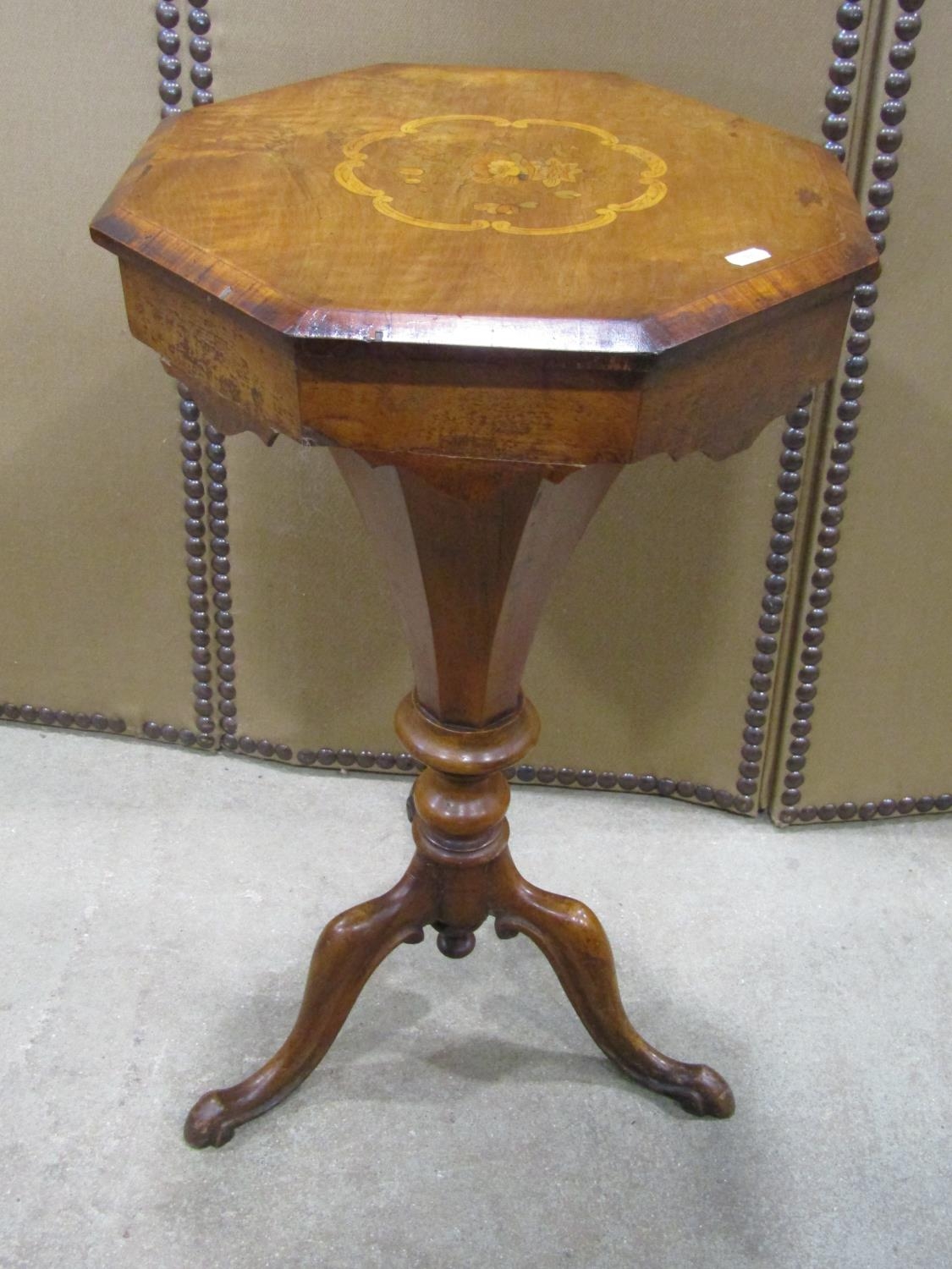A Victorian walnut trumpet sewing table/work box, the hinged octagonal lid with inlaid floral detail