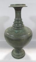 An Asian heavy bronze vase, a bulbous body with a tapering ring turned neck, 49cm high.