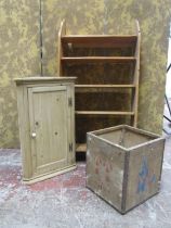 A stripped and waxed pine hanging corner cupboard with panelled door, a flight of open shelves and a