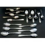 Twelve matching silver teaspoons set across two cases and a third case of six silver teaspoons, 18