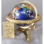 An ICYY Co. Gemstone Globe, with countries picked out in various semi-precious stone, set on a brass