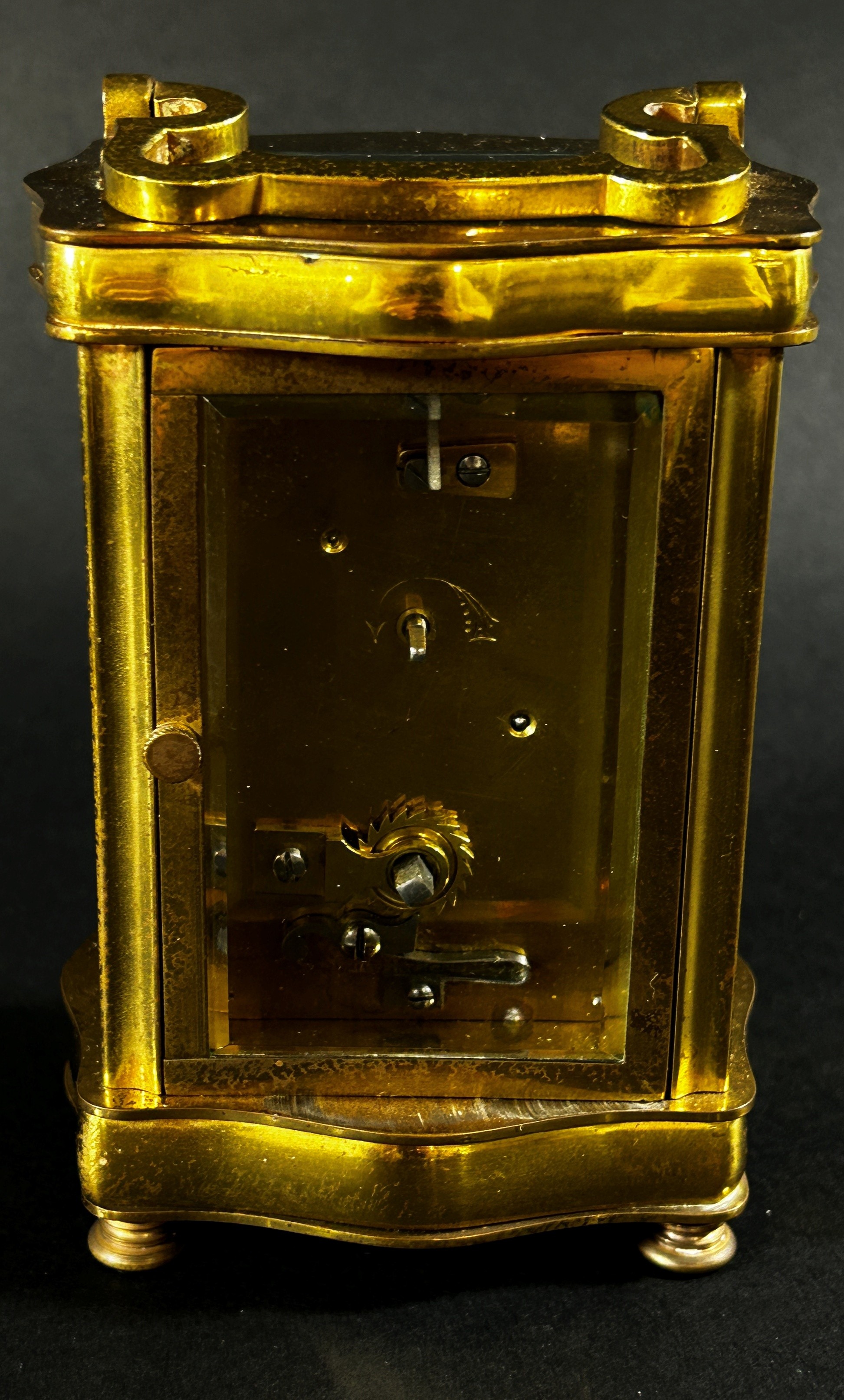 A brass carriage clock set within a shaped case with enamelled dial and eight day timepiece, - Image 3 of 5