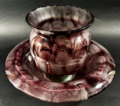 An early 20th century purple “marble” glass bowl and vase, 35cm wide and 20cm high respectively.