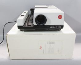 A Leica P 155 slide projector, with instruction manual and original box.