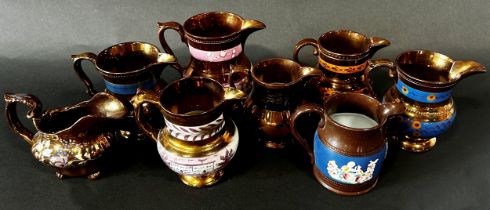 A collection of 19th century copper lustreware comprising graduated mugs, jugs, etc (16 pieces)