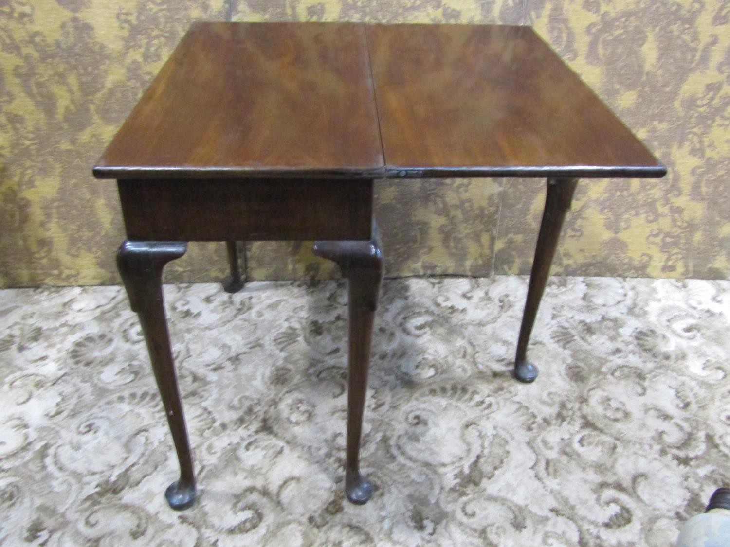 A Georgian mahogany rectangular fold over top tea table with central frieze drawer raised on - Image 3 of 4