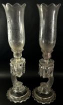 A pair of Baccarat Crystal and Cut Glass Dolphin Lustre Candlesticks, each with a removable engraved
