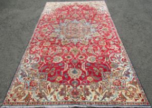 A vintage Persian Nafabad with all over floral design in reds and blues, 315cm x 174cm