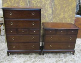 A Stag Minstral bedroom chest of four long and three short drawers together with a further example