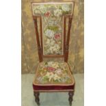 A good Victorian upholstered priedu with floral tapestry upholstered seat and T shaped back within a