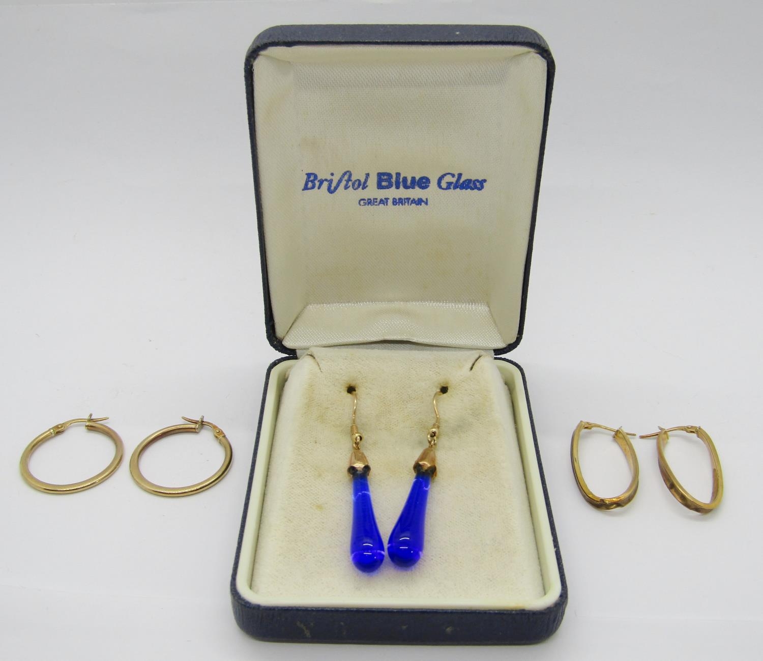 Two pairs of Italian 9ct hoop earrings, 2.5g total and a further boxed pair of Bristol Blue Glass