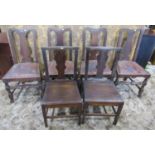 A set of four antique dining chairs with vase shaped splats and drop in seats, raised on turned