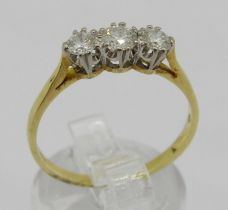 18ct three stone diamond ring, centre stone 0.20ct approx, outer stones 0.15ct each approx, London