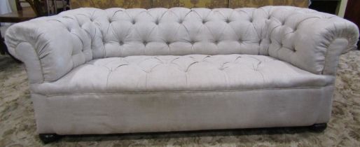 A traditional Edwardian button back Chesterfield sofa on bun feet, reupholstered in linen, 2m wide