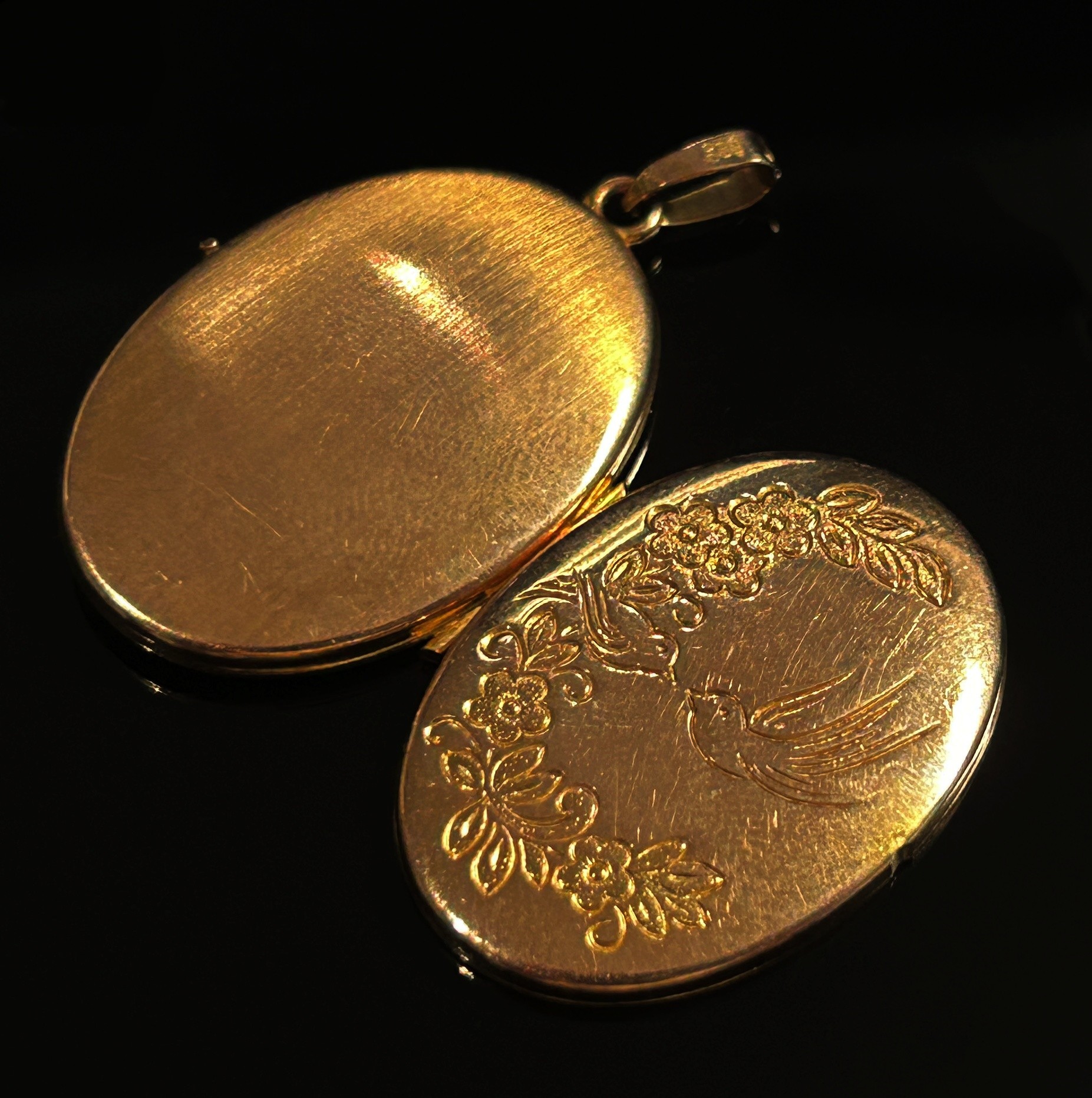 Three 9ct pendants; two St Christopher examples and a locket with engraved decoration, 9.4g total ( - Image 5 of 5