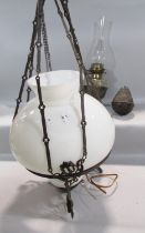 A Victorian cast iron adjustable pendant oil lamp, with an electric conversion and opaque white