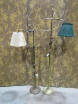 Two similar brass adjustable floor-standing reading lights, each with bow finial handles