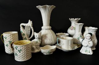 A collection of Belleek mugs, etc (14)
