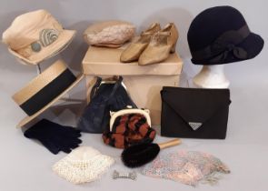 A collection of 1920's ladies accessories comprising the following; a blue felt cloche hat with