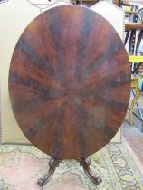 A 19th century mahogany breakfast table, the oval top with well match flamed and segmented