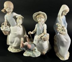 Three Lladro figures, one of a girl shepherding Turkey's, another holding a Lamb, a third with a