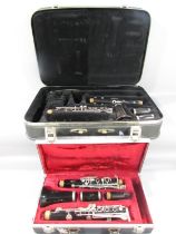 A Boosey & Hawkes Regent Clarinet in a hard case, and a Boosey & Hawkes Emperor clarinet in a hard
