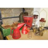 Two vintage fire buckets, box of carpenter's planes, Tilley paraffin lamps, blow lamps, garage oil