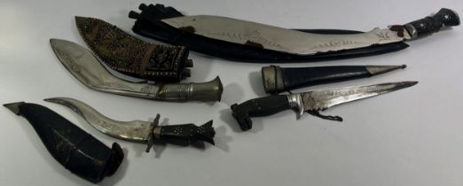 A collection of eleven Eastern Kukri daggers and other Middle Eastern daggers.