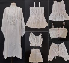 A collection of early 20th century white cotton lingerie including a ladies nightgown trimmed with