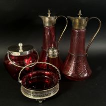 A mixed selection of 19th century Cranberry glassware including a pair of claret jugs, a decanter,