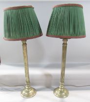 A pair of brass column lamps both with shades, 60cm high approx.