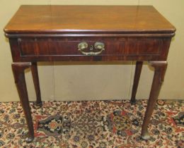 A mid-Georgian period foldover card table with single frieze drawer and raised on four pad feet with