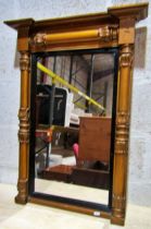 A Regency pier glass with turned and moulded column supports 84cm x 60cm