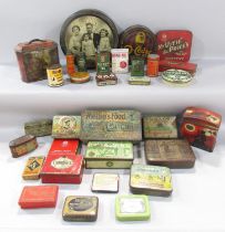 A quantity of early 20th century advertisement tins.