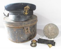 A tin hat box containing a Naval Officer’s cap and Albert Ernest Mehagan’s death plaque.